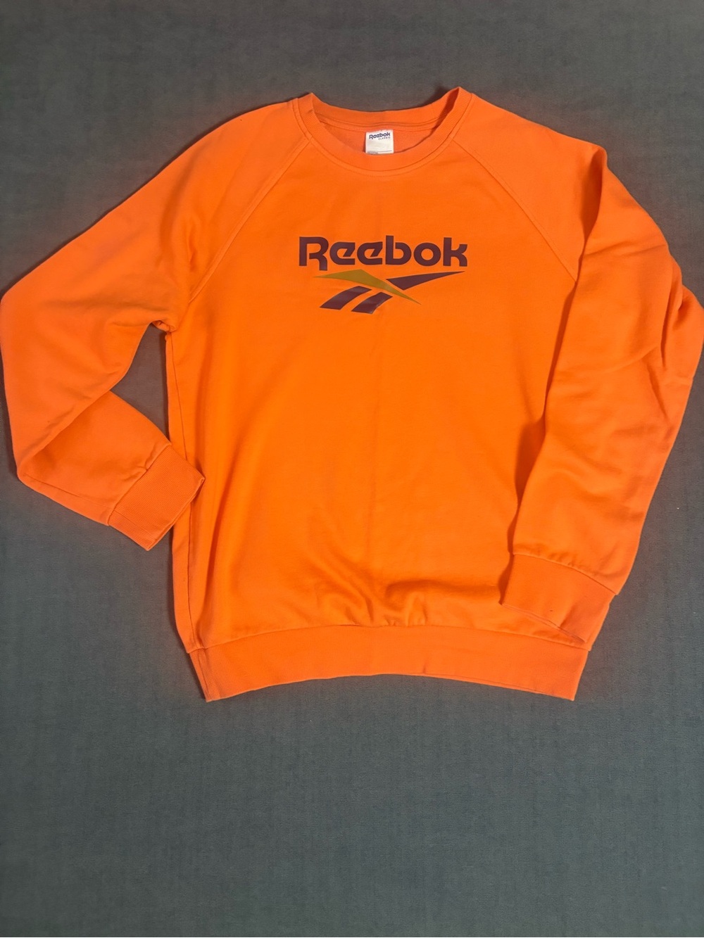 Reebok Men’s Bright Orange Crewneck Sweatshirt with Navy Logo